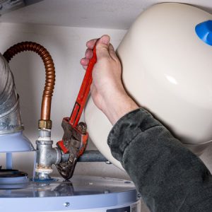 Tightening a pipe on a water heater